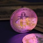 Bitcoin coin and us dollar bills.