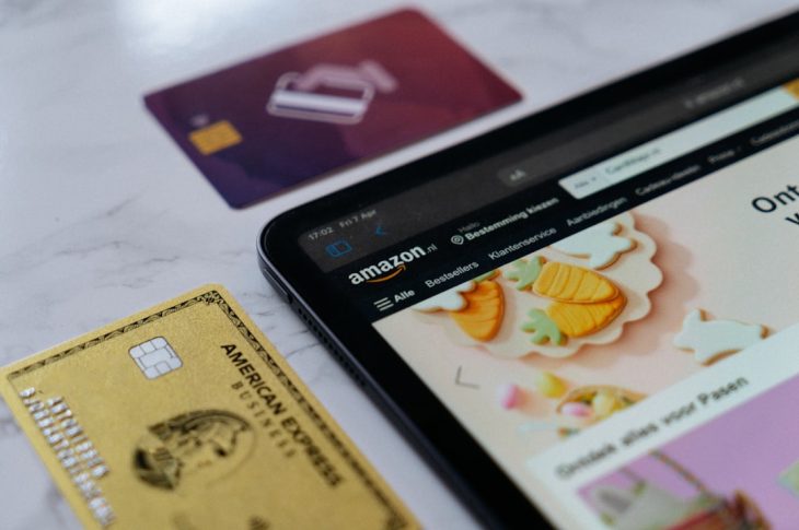a smart phone sitting next to a credit card